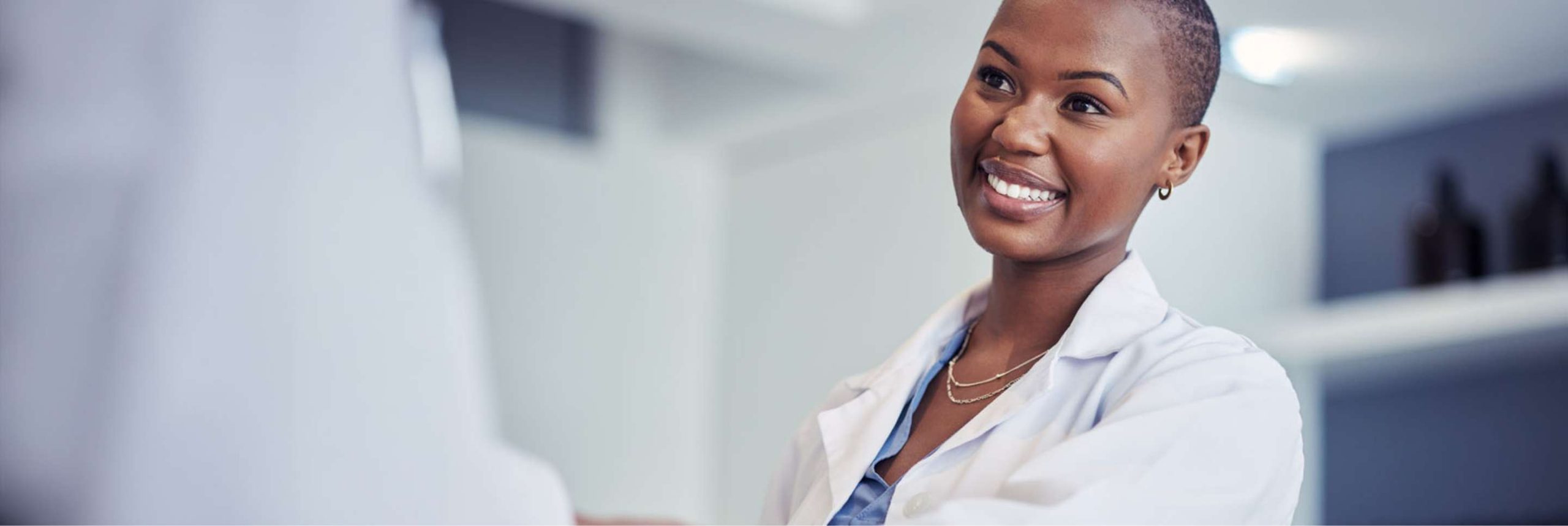 female dermatologist smiling