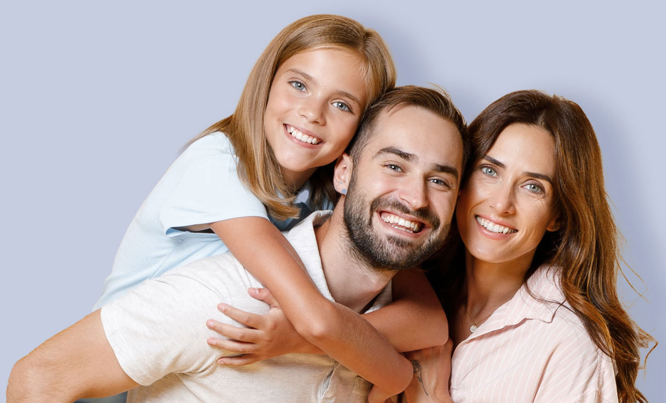 family smiling and playing